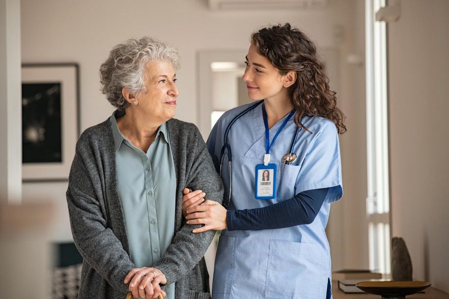 A nurse sharing a moment with a resident at Monroe Springs Rehab