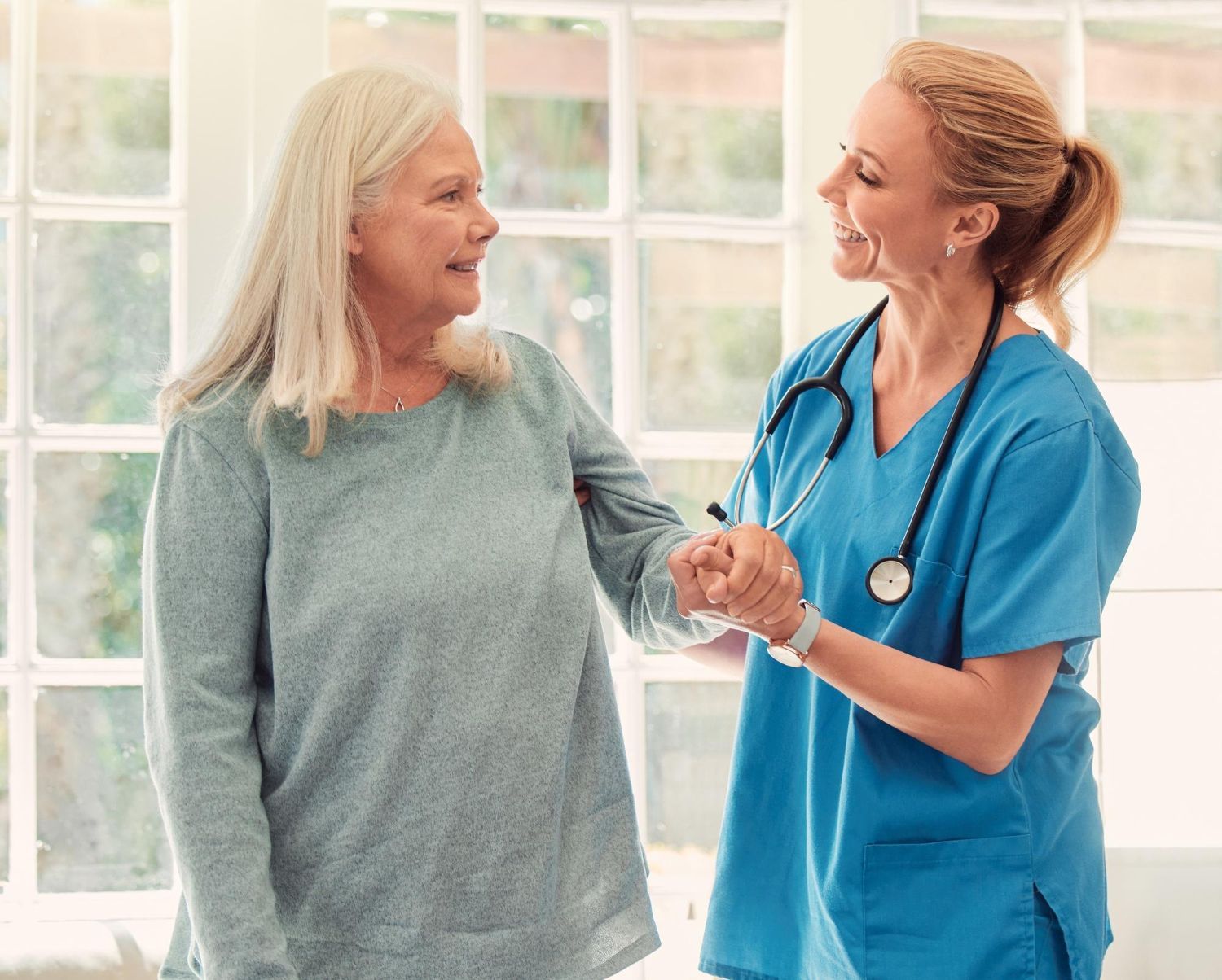 A nurse sharing a moment with a resident at Monroe Springs Rehab